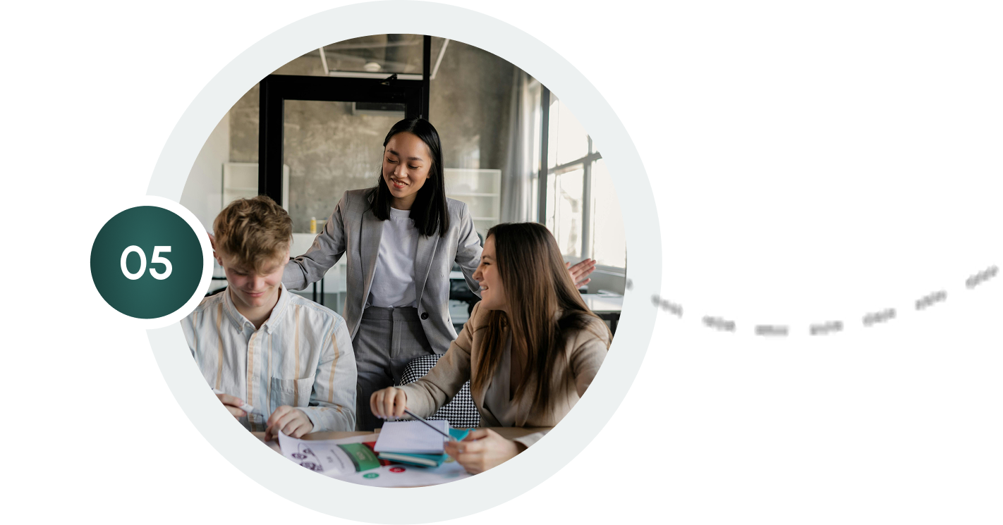 Homepage update team collaboration: Three colleagues brainstorming business strategies in a modern office, step 5.